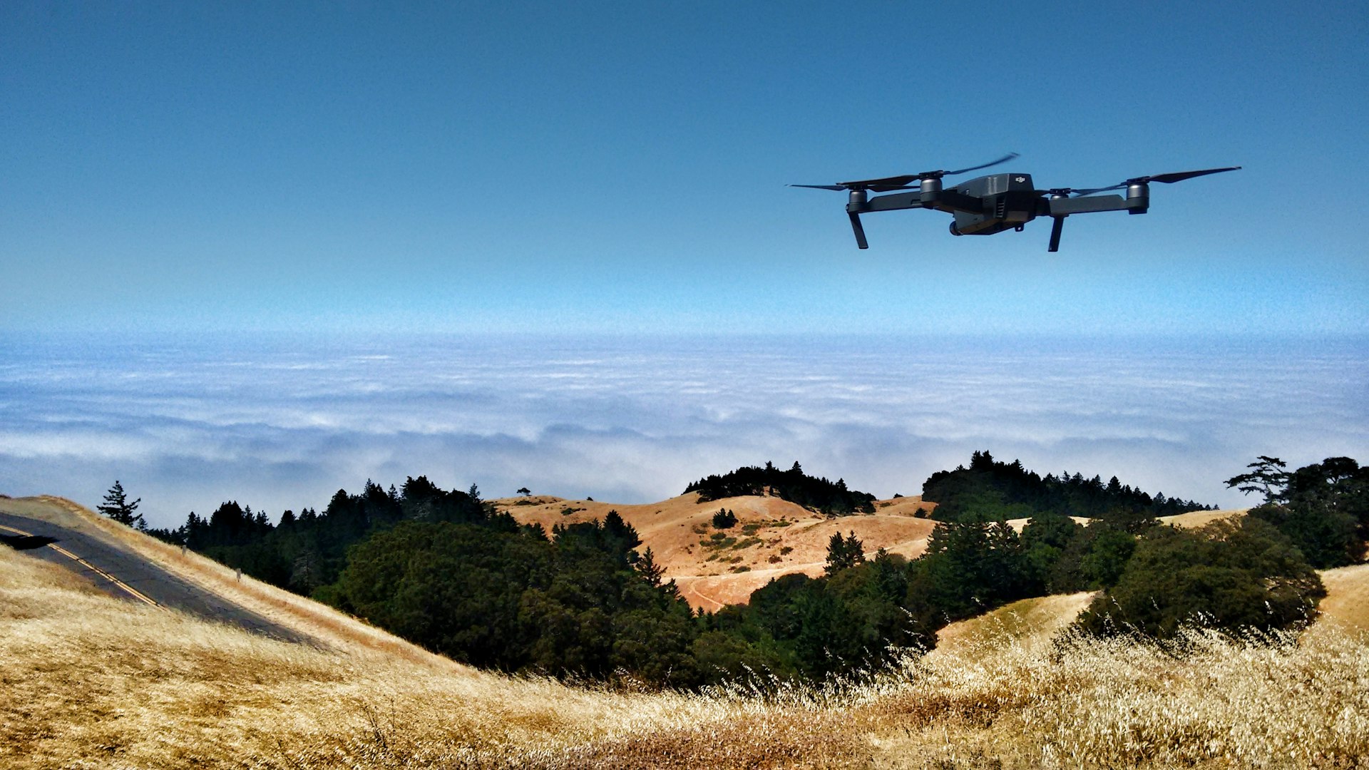 Rogue drone flying in the sky above critical infrastructure